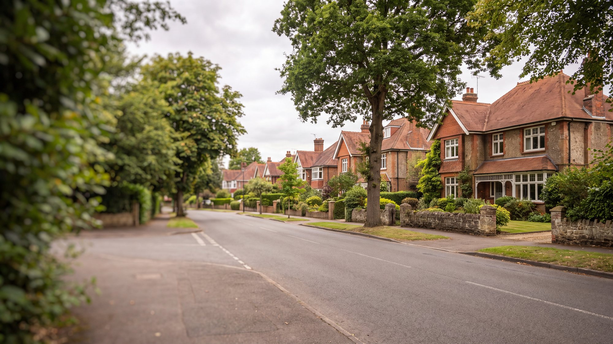 A quiet Surrey residential street of period houses with well kept tiled roofs