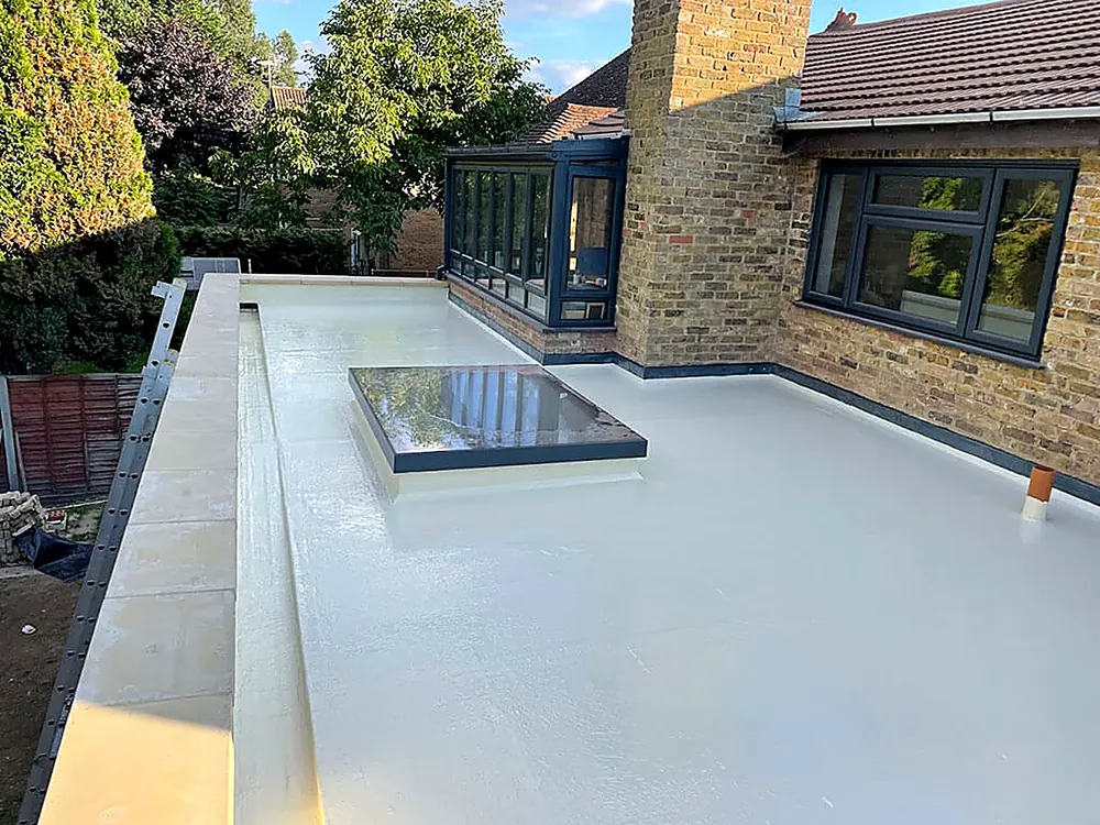 A white fibreglass flat roof with a flush rooflight
